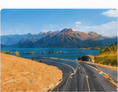 Winding mountain road beside a lake